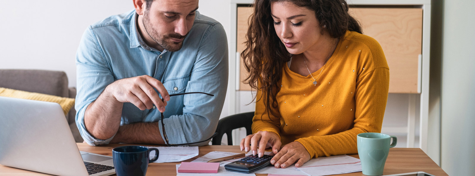 couple looking at calculators