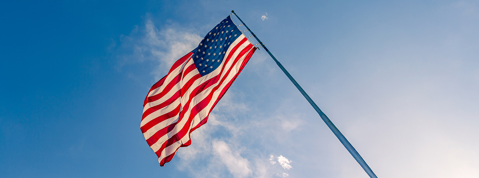 a patriotic image of an American flag fluttering in the breeze